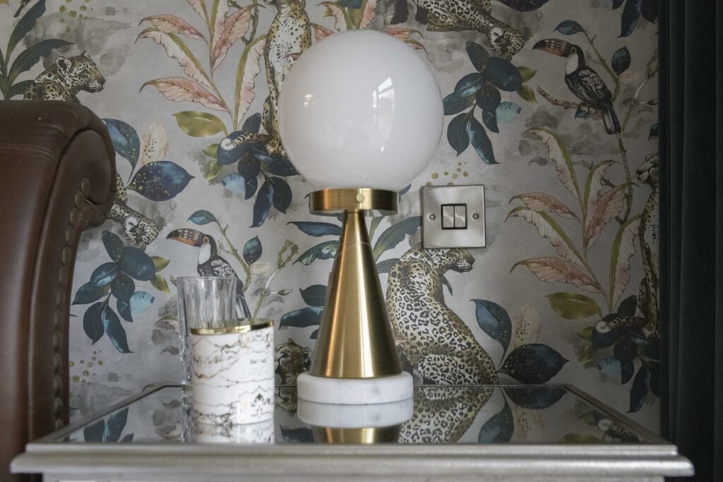 Bedside detail with brass and marble lamp, Yorkshire
