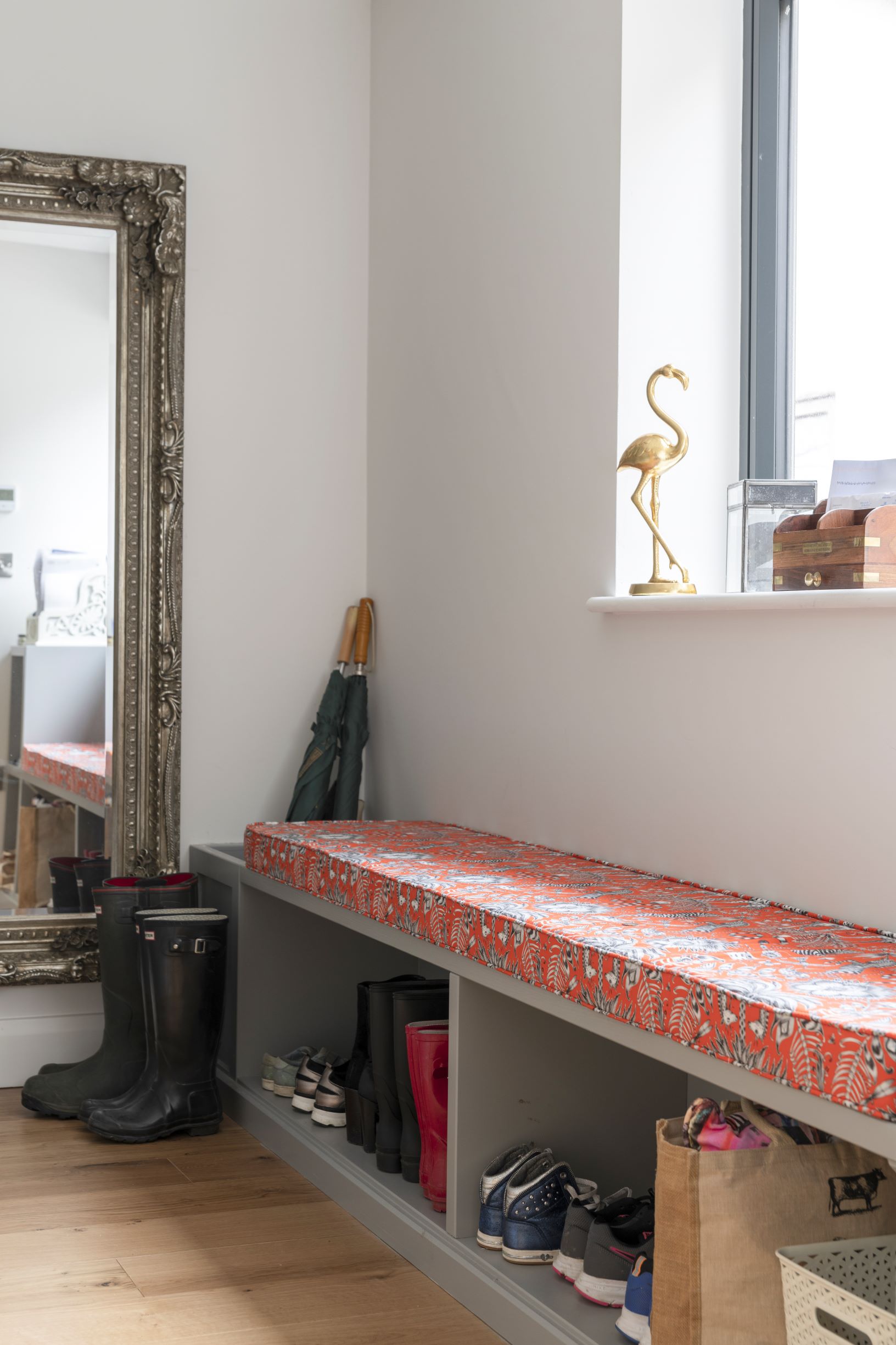 This boot room has plenty of storage and style to boot, thanks to the vibrant box cushion