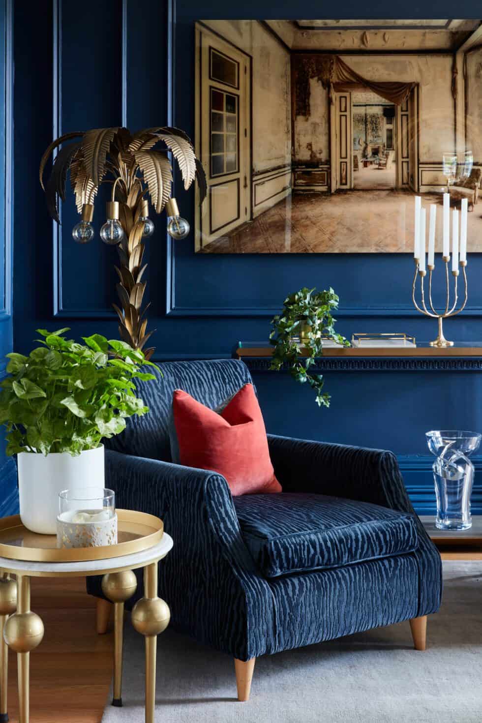 Art always adds heart to any room and this evocative piece perfects this rich navy drawing room, where oak floors and pale grey rug the rich hues.